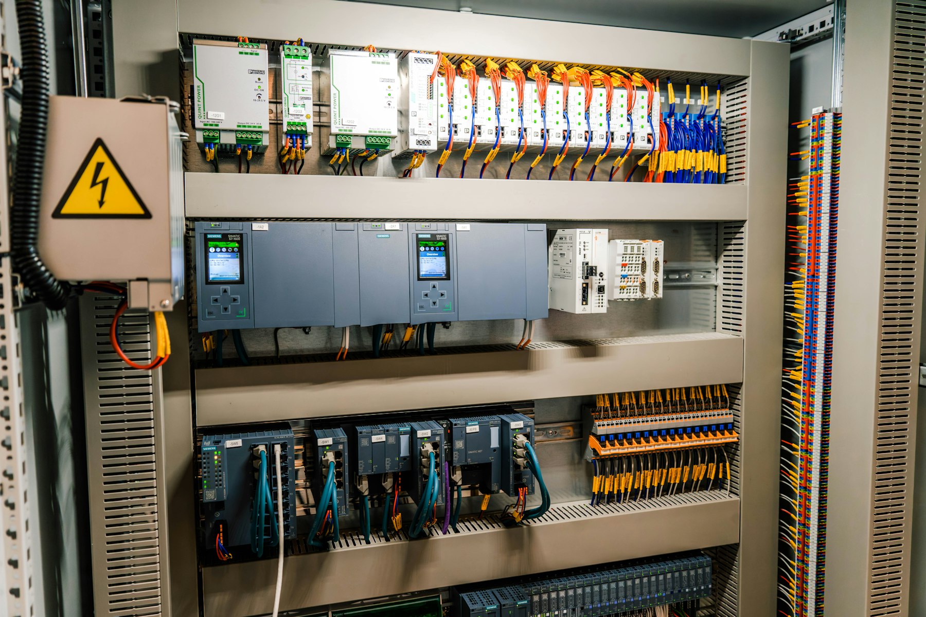 Industrial automation control cabinet with controllers and I/O wiring